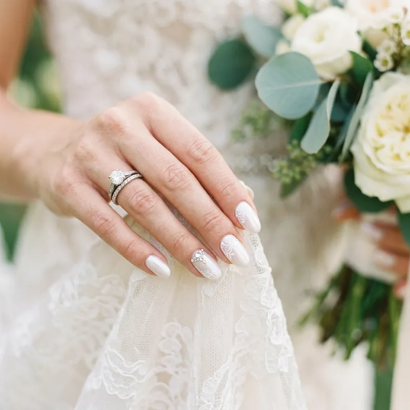 Bridal nail art with pearls and shimmer