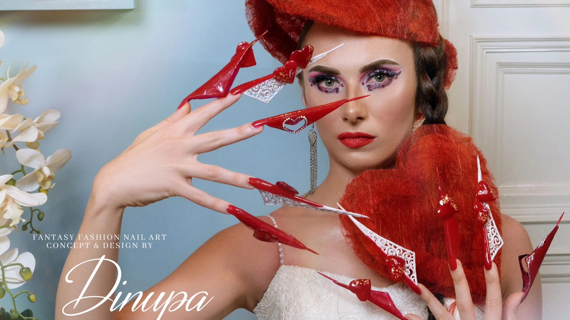 Fantasy red nail-art design on a fashion model by The Nail Art Academy